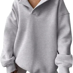 Women's grey oversized long sleeve sweatshirt with polo collar and ribbed cuffs