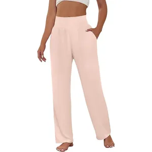 High-waisted wide-leg pink yoga pants with side pockets and elastic waistband.