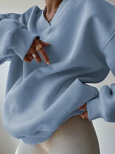 Close-up of light blue oversized sweatshirt showing soft fabric texture and casual fit