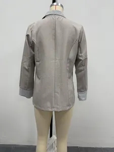 Back view of grey women's blazer featuring striped contrast collar and cuffs detail