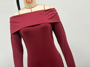 Elegant burgundy off-the-shoulder long sleeve maxi dress detail on professional mannequin.