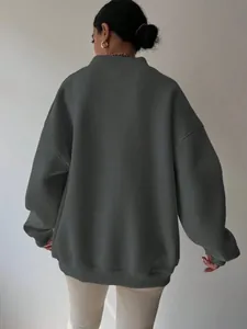 Back view of a dark grey oversized sweatshirt showing the loose fit and soft texture