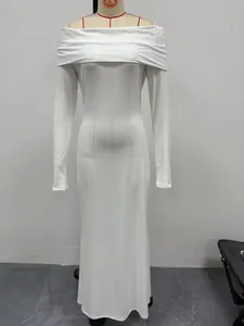 Elegant white off-the-shoulder long-sleeve maxi evening dress on a mannequin form
