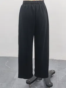 Detailed back view of women's black high-waisted wide-leg sports casual sweatpants on mannequin