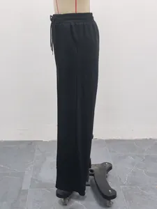 Side view of black high-waisted wide-leg sweatpants with drawstring