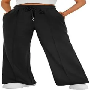 Close-up detail of high-waisted black wide-leg sweatpants featuring adjustable drawstring