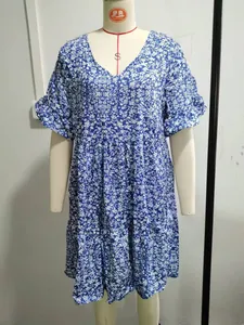 Detailed close-up showing the floral print and ruffle sleeve design of this V-neck dress.