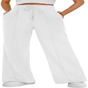 Close-up detail of white high-waist wide-leg sweatpants with drawstring