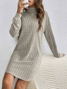 Close-up detail of grey ribbed knit long sleeve dress with high turtleneck on model