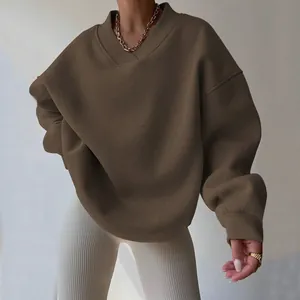 Cozy oversized brown V-neck sweatshirt for women, perfect for a casual autumn street look
