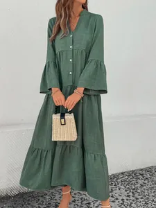 Full view detail of a sage green Mori style tiered V-neck midi dress with bell sleeves.