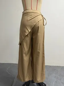 Close-up detail of khaki wide-leg suit pants featuring a unique irregular wrap design