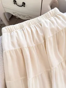 Elegant French style cream tiered maxi skirt with elastic waist for a gentle summer look