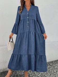 Elegant blue V-neck tiered A-line midi dress with long bell sleeves and button detail