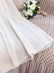 Elegant white French style maxi skirt featuring a delicate crinkled chiffon fabric texture