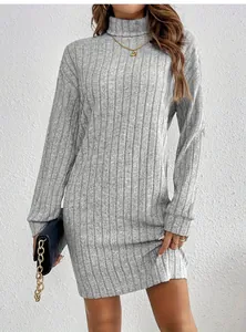 Detailed view of an elegant grey ribbed knit turtleneck dress for autumn fashion outfits.
