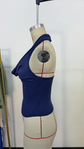 Side profile detail of navy blue halter neck backless top on a dressmaker mannequin