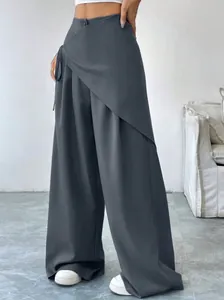 Front view of charcoal grey asymmetrical wide-leg suit trousers on a female model