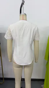 Detailed back view of white slim-fit short sleeve top featuring elegant lace hollowed sleeves