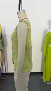 Side view of a light green sleeveless round neck button-down vest on a mannequin