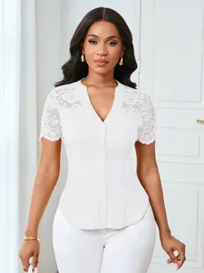 Elegant white slim-fit top with lace shoulders, V-neck and button-down ribbed design