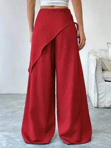 Red asymmetrical wrap wide-leg trousers for women with loose slimming fit detail