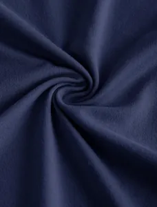 Detailed macro view of the navy blue ribbed knit fabric texture for women's tops