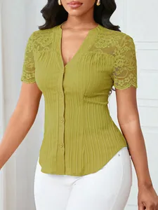 Close-up of olive green slim-fit blouse featuring delicate lace embroidery on shoulders.