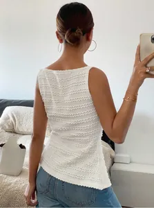 Back view of a white textured sleeveless slim fit tank top for women in a home setting