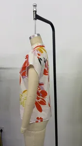 Side profile detail of elegant women's floral print blouse featuring a ruffled neck