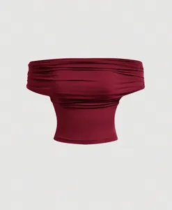 Detail view of the elegant burgundy ruched off-the-shoulder crop top with fabric texture