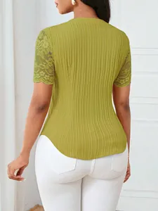 Back view of a lime green ribbed top with detailed floral lace sleeves and slim fit