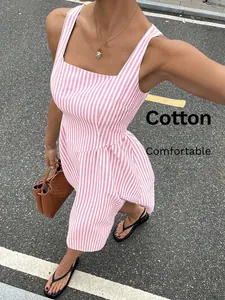 Detailed shot of the French style pink and white striped cotton dress with square neck.