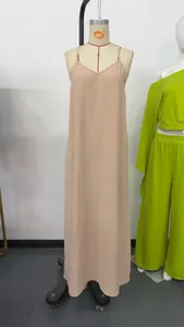 Elegant apricot V-neck camisole maxi dress featuring minimalist design and textured fabric