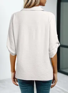 Detailed back view of women's white 3/4 sleeve polo shirt featuring textured fabric