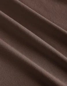 Macro close-up detail of soft brown ribbed knitted fabric for a women's halter top