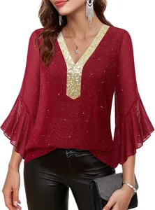 Detailed view of wine red blouse with sparkling gold sequin V-neck and bell sleeves