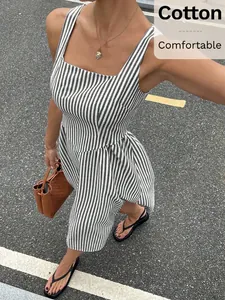 Detailed view of a sleeveless striped French dress with square neck and cinched waist.