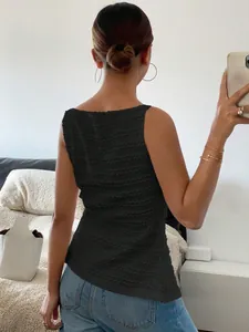 Detailed back view of a black sleeveless slim fit top with unique wavy textured fabric