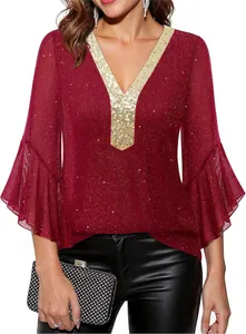 Detail view showing the elegant V-neck with gold sequins and glitter fabric texture