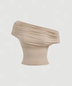 Macro view of the elegant ruched fabric on this beige versatile one-shoulder crop top