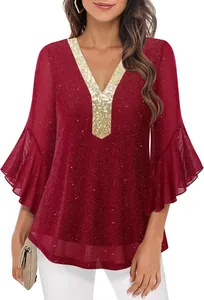 Detail view of the red sequined V-neck blouse with gold trim and flared sleeves