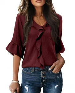 Elegant casual V-neck burgundy blouse with textured fabric and ruffle sleeve details