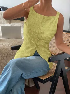 Textured yellow sleeveless vest with single-breasted button front detail shown on model.