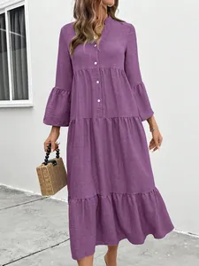 Elegant purple tiered midi dress with V-neckline and stylish bell sleeves for summer