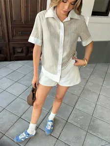 Stylish striped short sleeve polo shirt with matching white shorts set for fashionable women