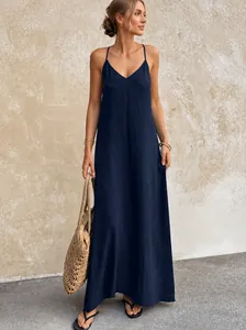 Full-length view of a navy blue V-neck slip dress with textured fabric.