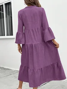 Back view of a chic purple tiered A-line dress featuring elegant ruffle bell sleeves.
