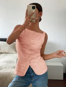 Detail view of pink textured slim fit tank top with single-breasted buttons