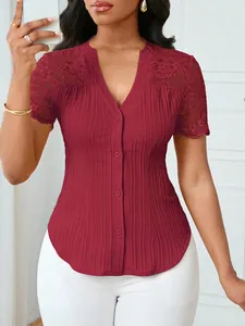 Detail view of burgundy button-up top with delicate lace shoulders and ribbed texture